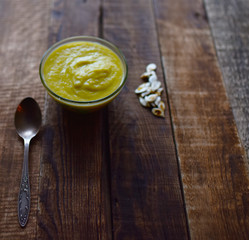 pumpkin soup mashed on a wooden table