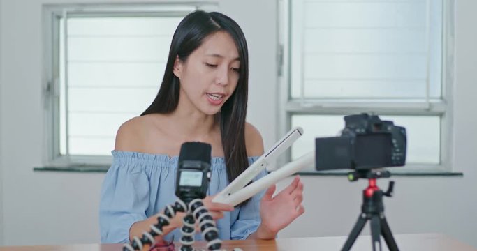 Woman showing hair product to the camera