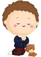 
a kid praying with a teddy bear beside him

