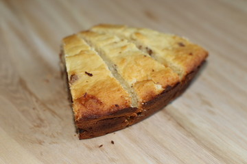 Homemade cake with jam on wooden desk