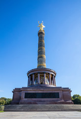 Victory column in Berlin, Germany, blue sky, low angle.