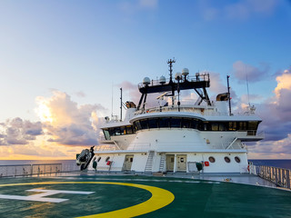 Control bridge station of a modern offshore vessel with helideck on the foreground