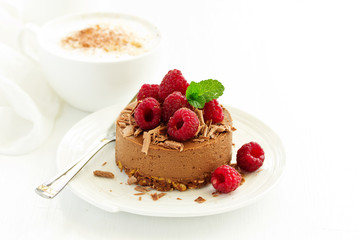 Delicious New York Chocolate Cheesecake with Raspberries. close-up.