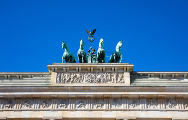 Obraz premium Brandenburg gate, Berlin, Germany, low angle against blue sky.