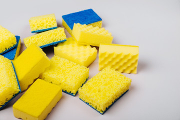 Sponges on gray background. Cleaning or housekeeping concept background. Copy space. Flat lay, Top view.