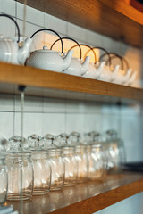 dishes on the shelves in the restaurant