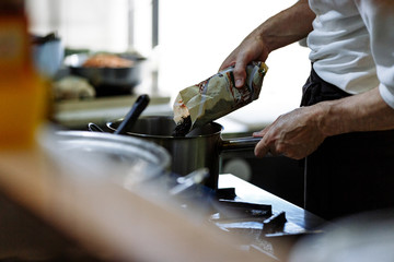 cook cooks in a restaurant kitchen