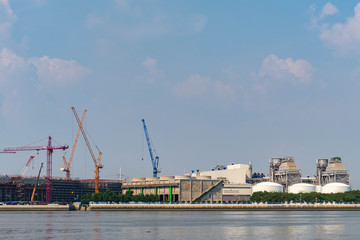 Large construction By the river with crane work.