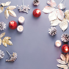 Winter concept flat lay with silver leaves, lantern, candles and hot coffee. Christmas frame background