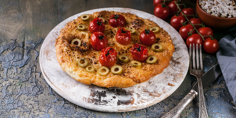 Delicious pizza four cheese with cherry tomatoes