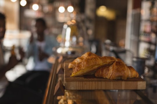 Croissants on wooden counter in cafe
