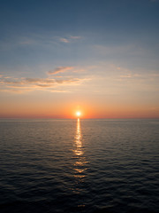 Sunset over calm sea on summer season