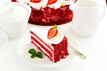a piece of delicious red velvet cake on a plate.