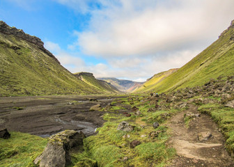 Fototapeta premium Panoramic view inside the great fissure of volcanic canyon Eldgja. Summer trekking in highlands of Iceland, Europe