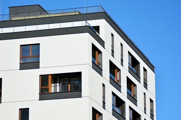 Modern apartment buildings on a sunny day with a blue sky. Facade of a modern apartment building