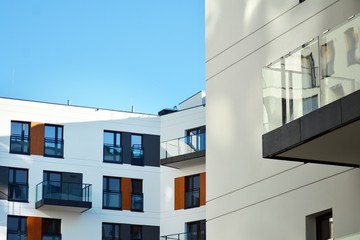 Modern apartment buildings on a sunny day with a blue sky. Facade of a modern apartment building