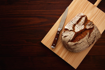 Rye bread on dark wooden table