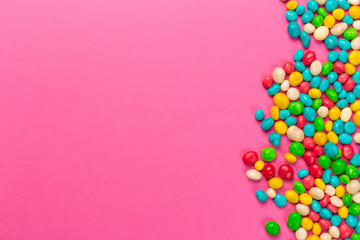 Colorful lollipops on a pink background