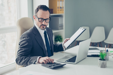 Banker broker man in formal wear sit on chair armchair behind de