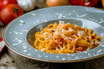 Spaghetti with vegetables in tomato sauce