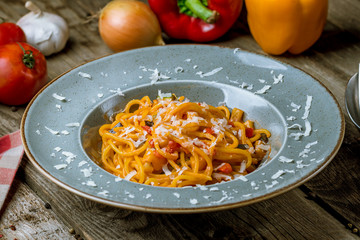 Spaghetti with vegetables in tomato sauce