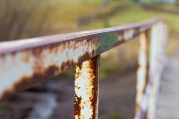 old rusty railing on the old bridge