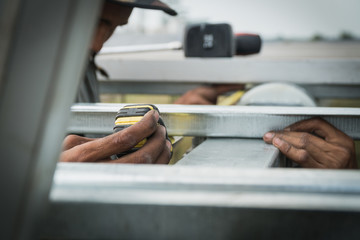 engineer and electrician installing solar power plant; scope of work at solar power plant tracking to sun