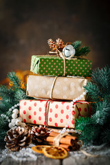 Merry Christmas and happy New year. Christmas gift and Christmas tree on dark wooden background....