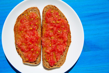 Bread toasted slices with grated tomato