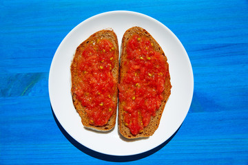 Bread toasted slices with grated tomato
