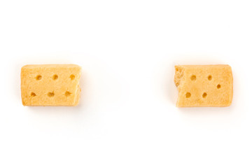 An overhead photo of two pieces of a Scottish shortbread butter cookie, shot from the top on a...