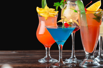 Multicolored cocktails at the bar close up shot