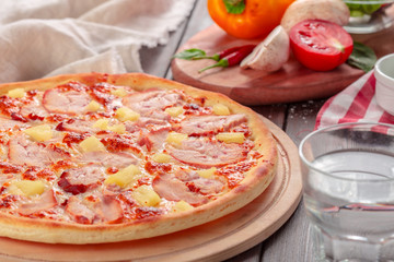 Delicious fresh pizza served on wooden table