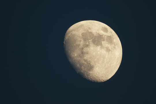 Waxing moon in the night sky.