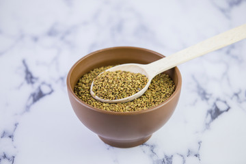 Fenugreek (Yellow tea, Methi, Shambala) seeds on white background