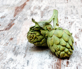 Artichokes surrounded by rustic background