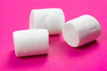 marshmallows on a pink background. top view