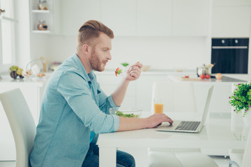 Calm attractive good-looking man look on pc gadget screen sit on