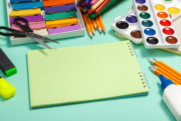 school supplies at abstract colorful background texture