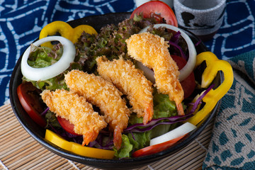 Salad with deep fried shrimps.