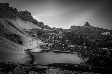 Fototapeta na wymiar Beautiful lake in dolomitic landscape black and white effect, South Tyrol, Italy