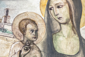 Fototapeta na wymiar Ancient fresco of Mary with the baby jesus