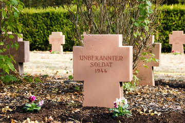 War memorial cemetery of the fallen German soldiers during the world war two (1938-1945) with a cross of a buried unknown soldier (German: Unbekannter Soldat)
