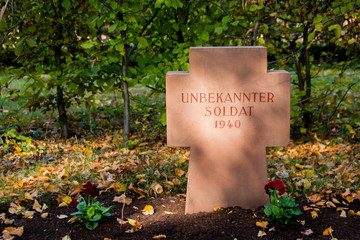 War memorial cemetery of the fallen German soldiers during the world war two (1938-1945) with a cross of a buried unknown soldier (German: Unbekannter Soldat)