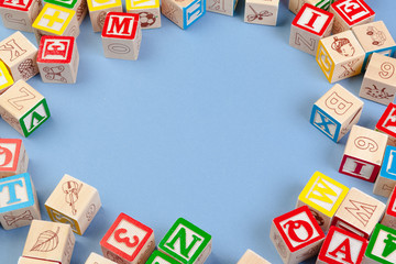 Letters background. Wooden cubes with letters with copy space