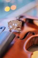 violin with blurred perspective bokeh light blue bokeh background © Vitaly