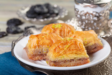 Oriental sweets, baklava, sherbet on a blue background