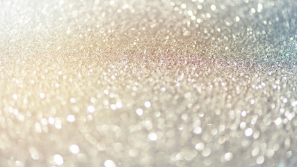 Blue and silver abstract bokeh lights. Shiny glitter background with copy space. New year and Christmas concept. Sparkling greeting card