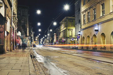 Naklejka na ściany i meble Old buildings in the historic district of Krakow at night