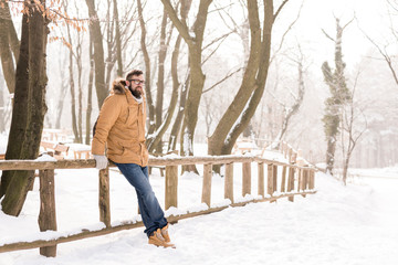 Man enjoying snowy winter day in nature